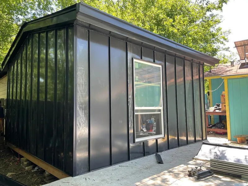 Black standing seam metal wall panels for Metal Roof Installation in Allegan